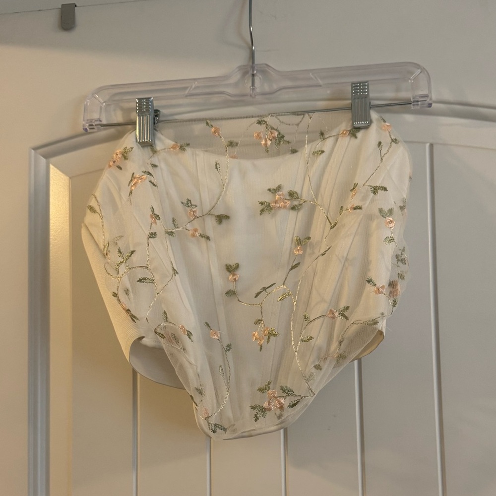 Cream floral embroidered corset top with adjustable straps